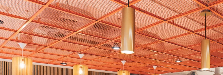 Manchester's Tootal Building renovated private offices featuring Banker WD-268 welded wire mesh as an accent ceiling feature.